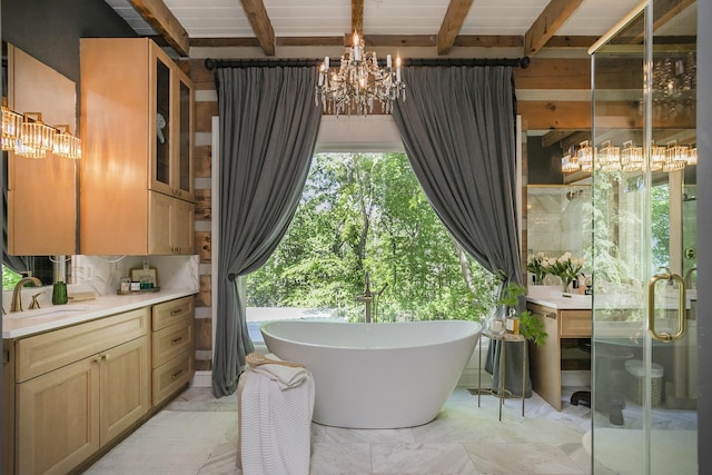 1105 Mount Pleasant Rd, Kingston Springs, TN 37082 - full bath featuring a chandelier, vanity, beamed ceiling, a soaking tub, and marble finish flooring