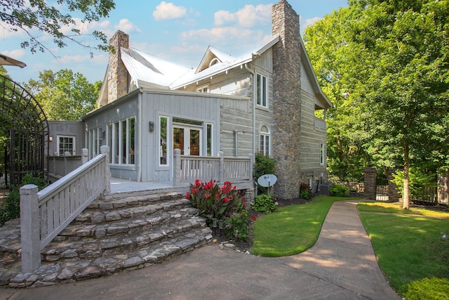 1105 Mount Pleasant Rd, Kingston Springs, TN 37082 - view of front of home with a chimney, central AC unit, and a front lawn