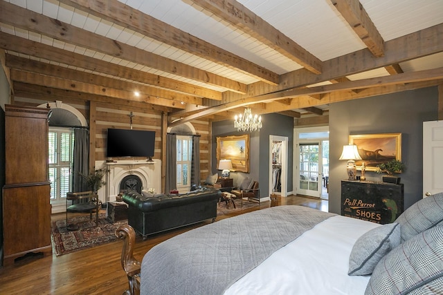 1105 Mount Pleasant Rd, Kingston Springs, TN 37082 - bedroom with wood finished floors, a chandelier, wooden walls, beam ceiling, and a fireplace