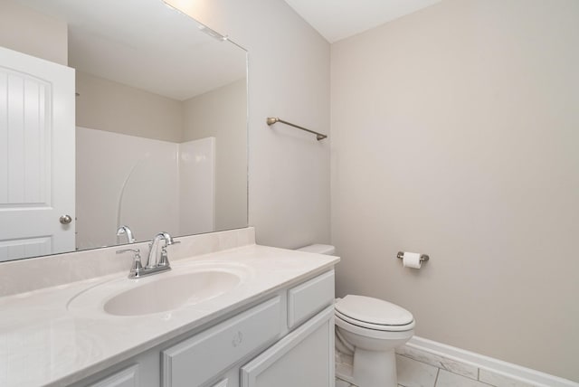 142 Rising Pvt Ln, Gallatin, TN 37066 - bathroom with toilet, vanity, marble finish floors, and baseboards