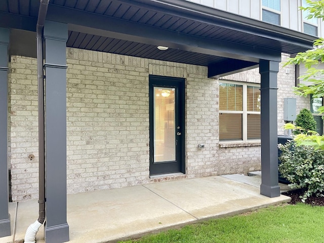 142 Rising Pvt Ln, Gallatin, TN 37066 - property entrance featuring brick siding, board and batten siding, and covered porch