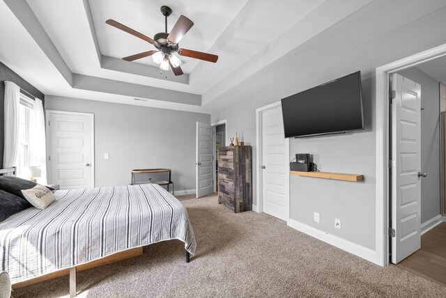 1341 Sussex Dr, Clarksville, TN 37042 - bedroom with a tray ceiling, carpet, baseboards, and ceiling fan