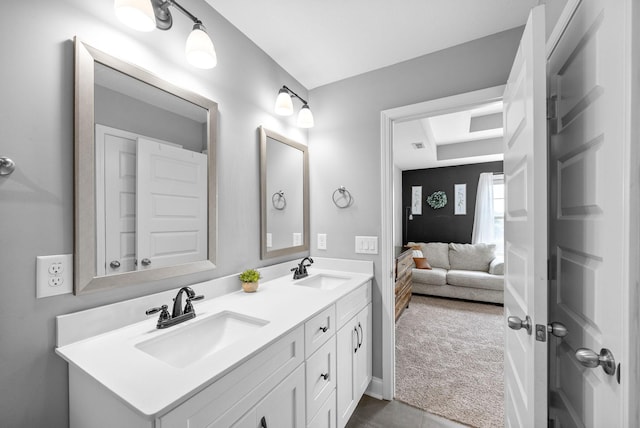 1341 Sussex Dr, Clarksville, TN 37042 - bathroom with double vanity, connected bathroom, and a tray ceiling