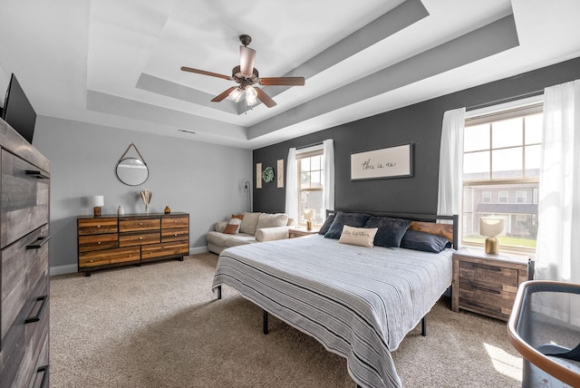 1341 Sussex Dr, Clarksville, TN 37042 - carpeted bedroom featuring a tray ceiling, a ceiling fan, and baseboards