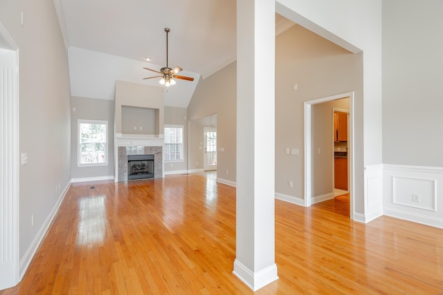 4370 Wellesley Dr, Ooltewah, TN 37363 - unfurnished living room featuring ceiling fan, light wood-style floors, high vaulted ceiling, a fireplace, and baseboards