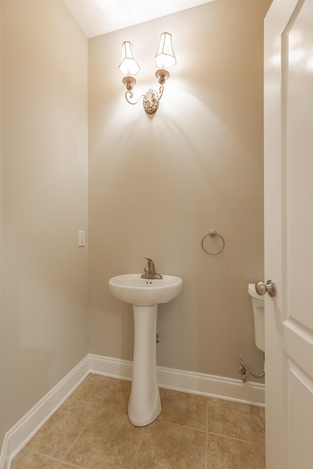 4370 Wellesley Dr, Ooltewah, TN 37363 - bathroom with baseboards, tile patterned flooring, and a sink