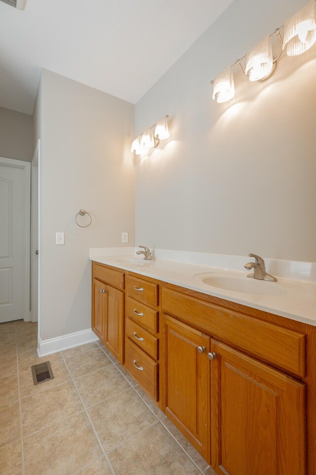 4370 Wellesley Dr, Ooltewah, TN 37363 - bathroom featuring double vanity, tile patterned flooring, and baseboards