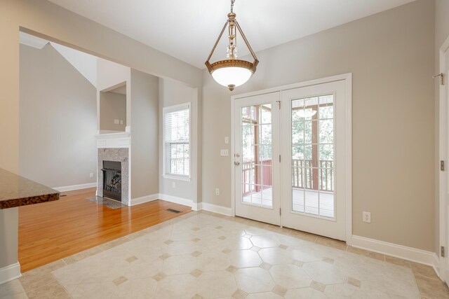 4370 Wellesley Dr, Ooltewah, TN 37363 - doorway to outside with a fireplace and baseboards