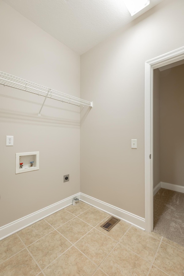 4370 Wellesley Dr, Ooltewah, TN 37363 - laundry area with electric dryer hookup, hookup for a washing machine, baseboards, and light tile patterned floors