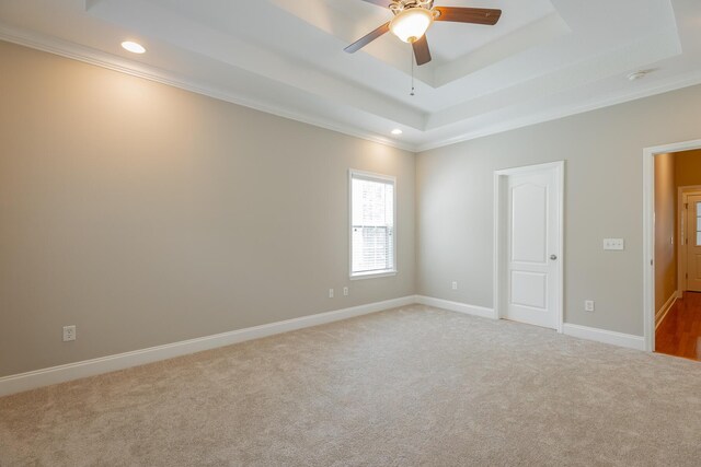 4370 Wellesley Dr, Ooltewah, TN 37363 - empty room featuring a raised ceiling, recessed lighting, ornamental molding, light colored carpet, and a ceiling fan