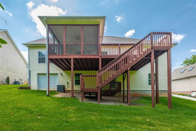 4370 Wellesley Dr, Ooltewah, TN 37363 - back of property featuring a sunroom, stairway, a deck, an attached garage, and a yard