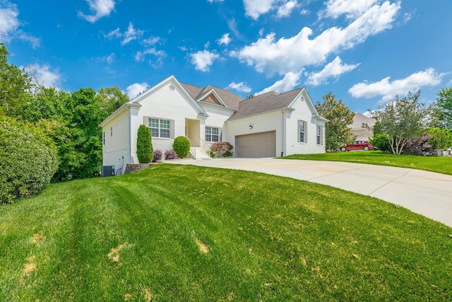 4370 Wellesley Dr, Ooltewah, TN 37363 - view of front of home with a front lawn, concrete driveway, a garage, and central AC