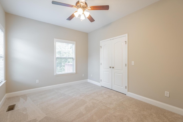 4370 Wellesley Dr, Ooltewah, TN 37363 - unfurnished bedroom featuring carpet floors, baseboards, a closet, and ceiling fan