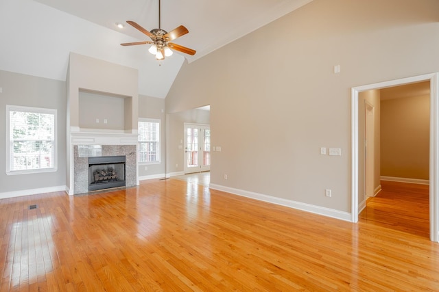 4370 Wellesley Dr, Ooltewah, TN 37363 - unfurnished living room featuring high vaulted ceiling, a ceiling fan, light wood-style flooring, a fireplace, and baseboards