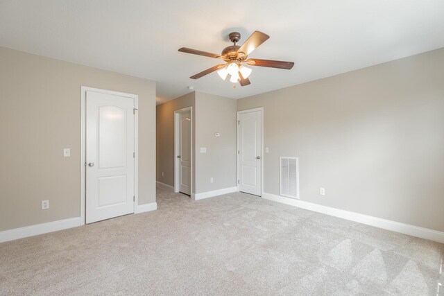 4370 Wellesley Dr, Ooltewah, TN 37363 - unfurnished bedroom with light carpet, baseboards, and a ceiling fan