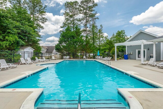 4370 Wellesley Dr, Ooltewah, TN 37363 - community pool with a pergola and a patio