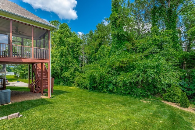 4370 Wellesley Dr, Ooltewah, TN 37363 - view of green lawn with a sunroom, stairs, and a ceiling fan