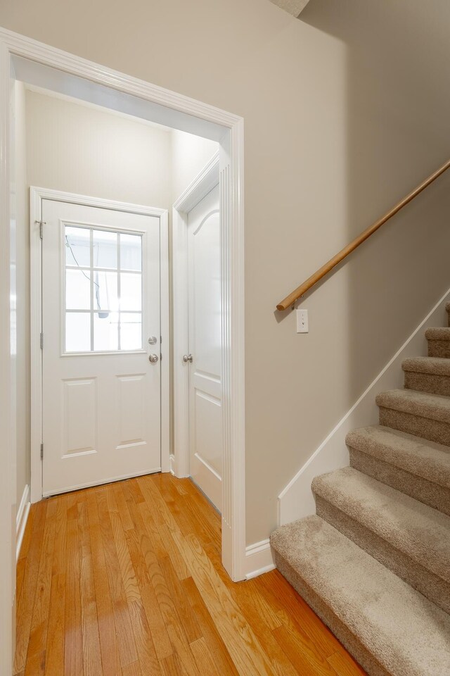 4370 Wellesley Dr, Ooltewah, TN 37363 - entryway featuring stairway, light wood-type flooring, and baseboards