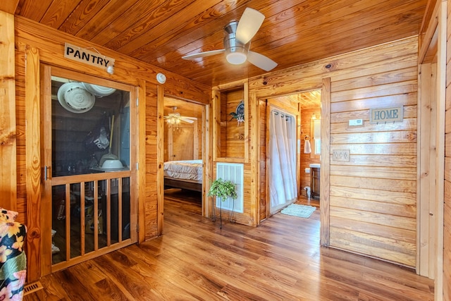 230 Silver Water Ln, Counce, TN 38326 - unfurnished bedroom featuring wooden walls, wood finished floors, and wood ceiling