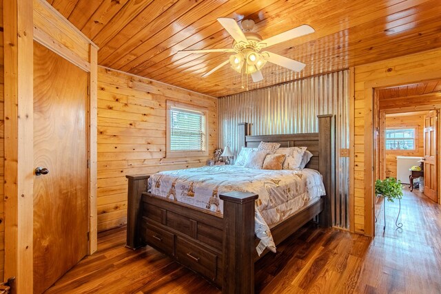 230 Silver Water Ln, Counce, TN 38326 - bedroom with wood ceiling, multiple windows, wood walls, wood finished floors, and ceiling fan