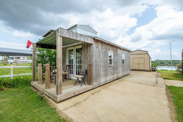 230 Silver Water Ln, Counce, TN 38326 - view of shed with a water view and french doors