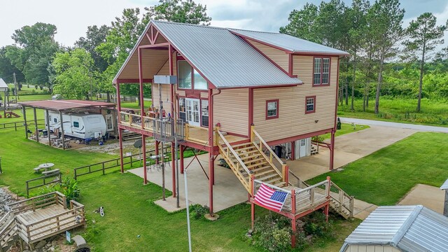 230 Silver Water Ln, Counce, TN 38326 - view of play area featuring stairs, a deck, and a patio