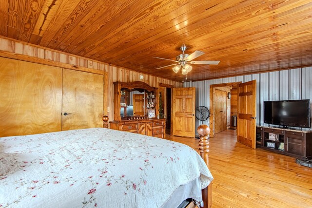 230 Silver Water Ln, Counce, TN 38326 - bedroom with wooden walls, wood ceiling, wood finished floors, and ceiling fan
