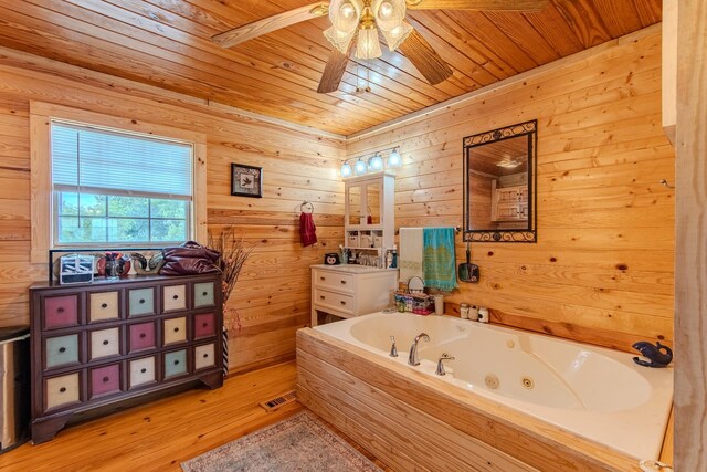 230 Silver Water Ln, Counce, TN 38326 - full bath with wood ceiling, a jetted tub, vanity, ceiling fan, and wood finished floors