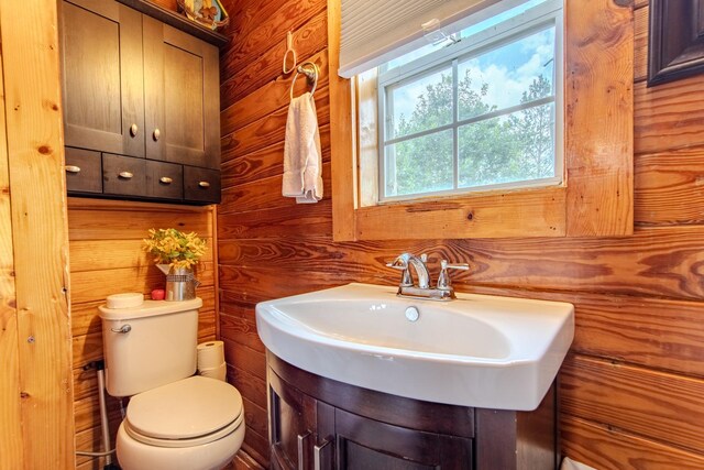 230 Silver Water Ln, Counce, TN 38326 - half bath with wooden walls, toilet, and vanity