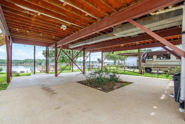 230 Silver Water Ln, Counce, TN 38326 - view of patio featuring a carport and a water view