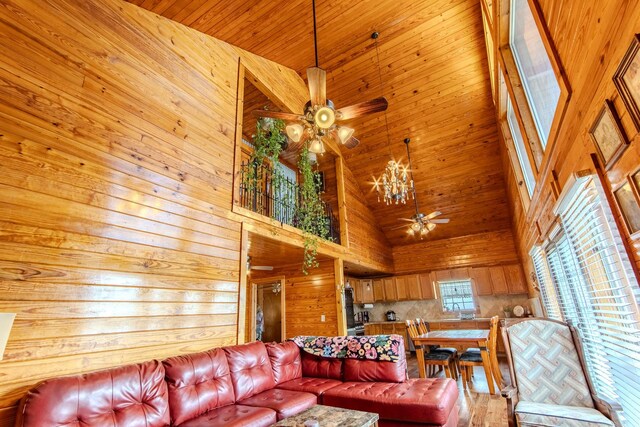 230 Silver Water Ln, Counce, TN 38326 - living room with a ceiling fan, a high ceiling, wood ceiling, and wooden walls