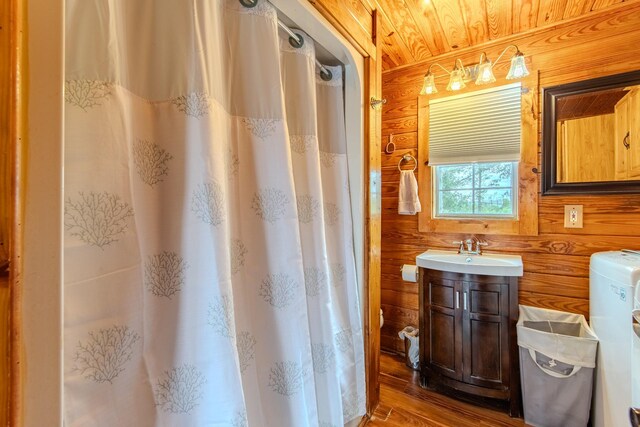 230 Silver Water Ln, Counce, TN 38326 - full bathroom featuring wooden walls, wood finished floors, vanity, curtained shower, and wood ceiling