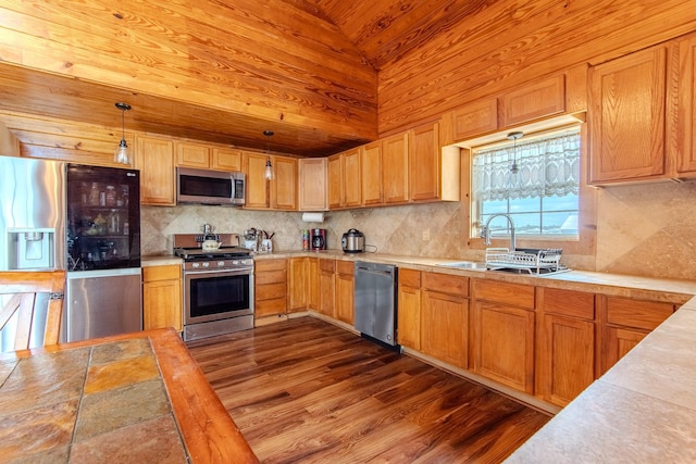 230 Silver Water Ln, Counce, TN 38326 - kitchen featuring appliances with stainless steel finishes, light countertops, a sink, decorative backsplash, and wooden ceiling