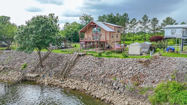 230 Silver Water Ln, Counce, TN 38326 - rear view of house featuring stairs and a deck with water view