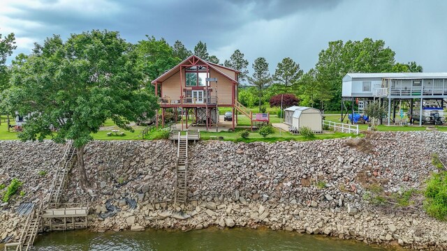 230 Silver Water Ln, Counce, TN 38326 - rear view of property with stairs, a deck with water view, and a yard