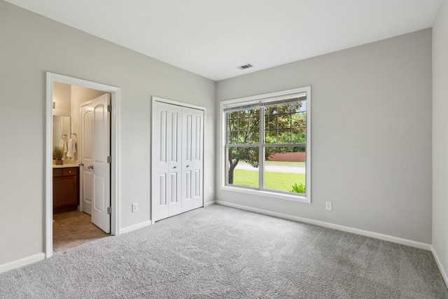 2040 Belshire Way, Spring Hill, TN 37174 - unfurnished bedroom featuring carpet, baseboards, ensuite bathroom, and a closet