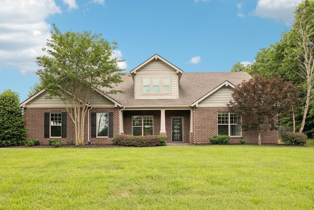 2040 Belshire Way, Spring Hill, TN 37174 - craftsman house with brick siding, a front yard, and a shingled roof