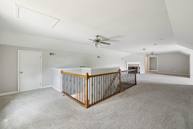 2040 Belshire Way, Spring Hill, TN 37174 - hallway with carpet flooring, lofted ceiling, baseboards, and attic access