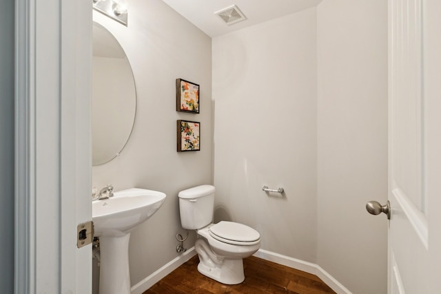 2040 Belshire Way, Spring Hill, TN 37174 - half bath with toilet, baseboards, wood finished floors, and a sink