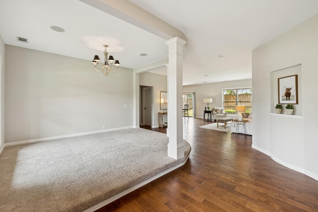 2040 Belshire Way, Spring Hill, TN 37174 - unfurnished room featuring decorative columns, dark wood finished floors, baseboards, and a chandelier