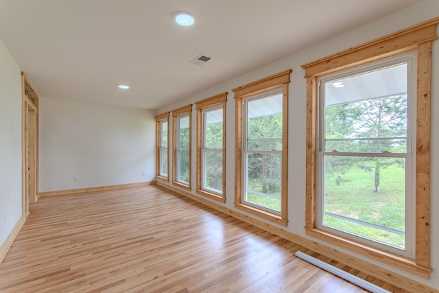 619 Bridgeview Cv, Bath Springs, TN 38311 - spare room with plenty of natural light, baseboards, light wood-style floors, and recessed lighting