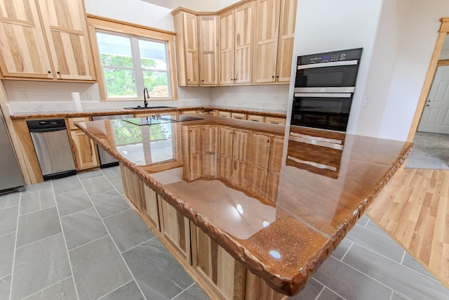 619 Bridgeview Cv, Bath Springs, TN 38311 - kitchen featuring a sink, dishwasher, double oven, and light brown cabinets