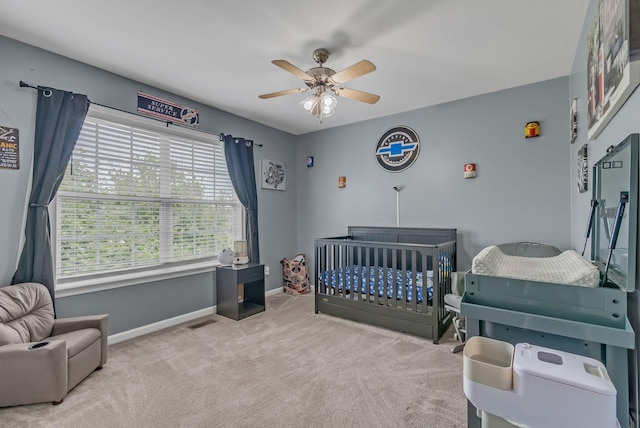 1305 Standing Stone Cir, Columbia, TN 38401 - bedroom with carpet floors, a crib, baseboards, and ceiling fan