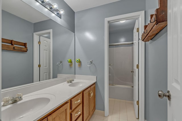 1305 Standing Stone Cir, Columbia, TN 38401 - bathroom featuring double vanity, tile patterned flooring, tub / shower combination, and baseboards