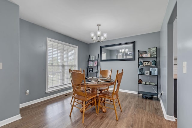 1305 Standing Stone Cir, Columbia, TN 38401 - dining space with a chandelier, wood finished floors, and baseboards
