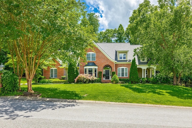 9542 Legacy Oaks Dr, Ooltewah, TN 37363 - view of front facade with brick siding and a front yard