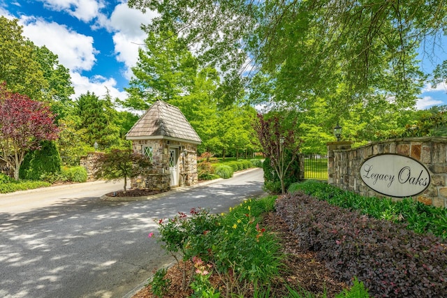 9542 Legacy Oaks Dr, Ooltewah, TN 37363 - community / neighborhood sign featuring view of wooded area