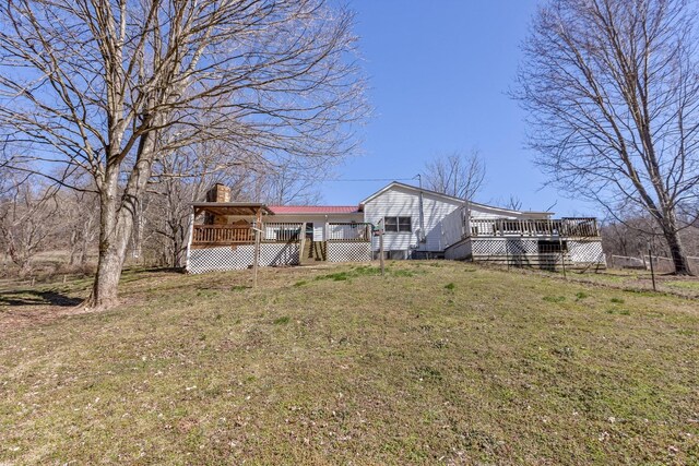 5312 Wiley Hollow Rd, Culleoka, TN 38451 - rear view of property with a wooden deck, a chimney, and a lawn
