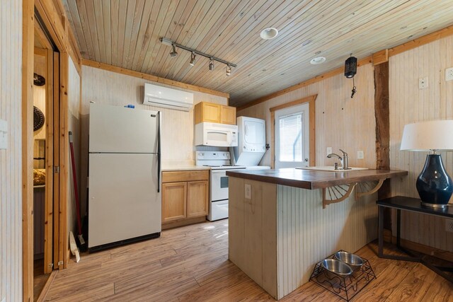 5312 Wiley Hollow Rd, Culleoka, TN 38451 - kitchen with white appliances, a wall mounted AC, light wood-style floors, a kitchen bar, and a peninsula