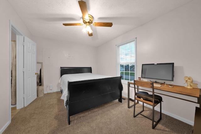 2879 Chinquapin Ln, Clarksville, TN 37043 - carpeted bedroom with a desk, baseboards, a textured ceiling, and ceiling fan